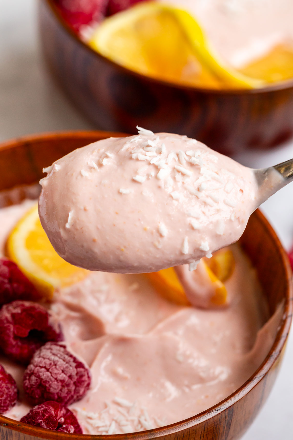 spoonful of whipped cottage cheese with raspberries