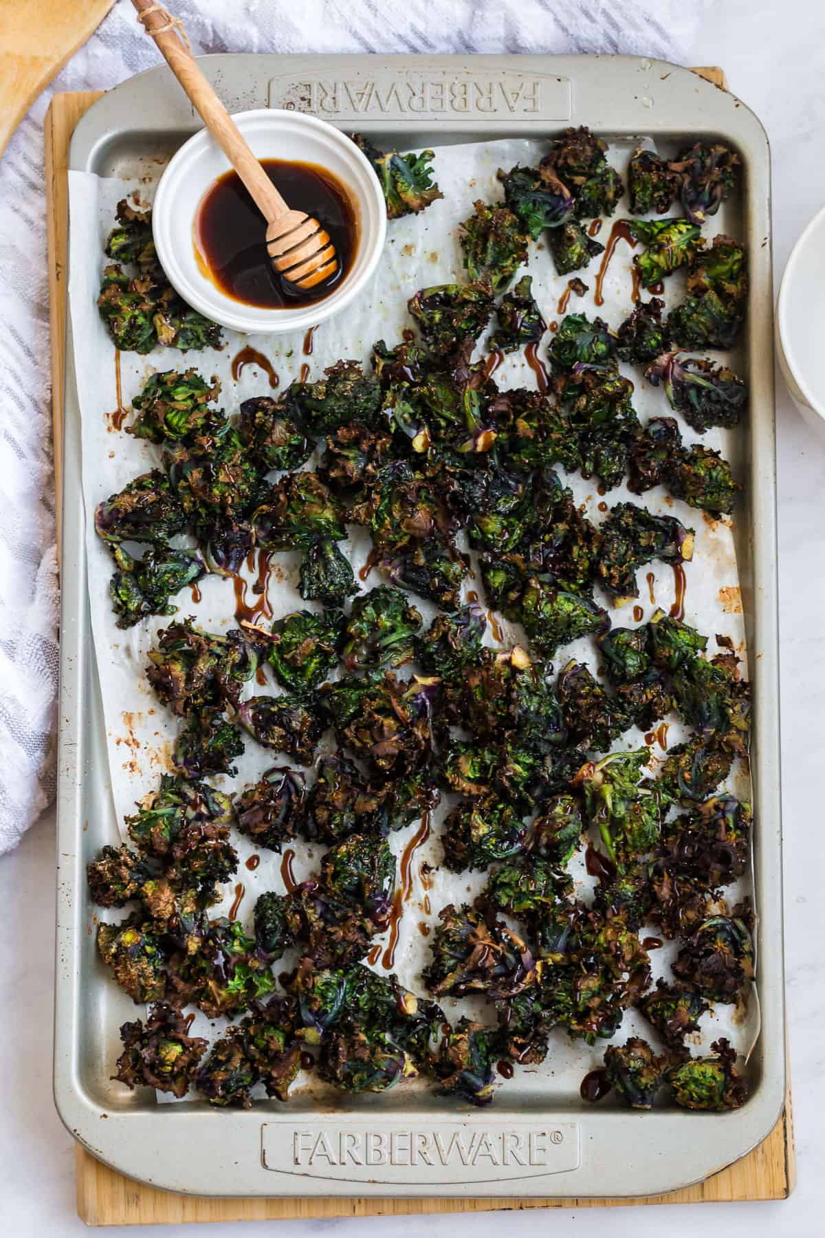 crispy baked palettes on a sheet pan with a drizzle balsamic glaze over top.