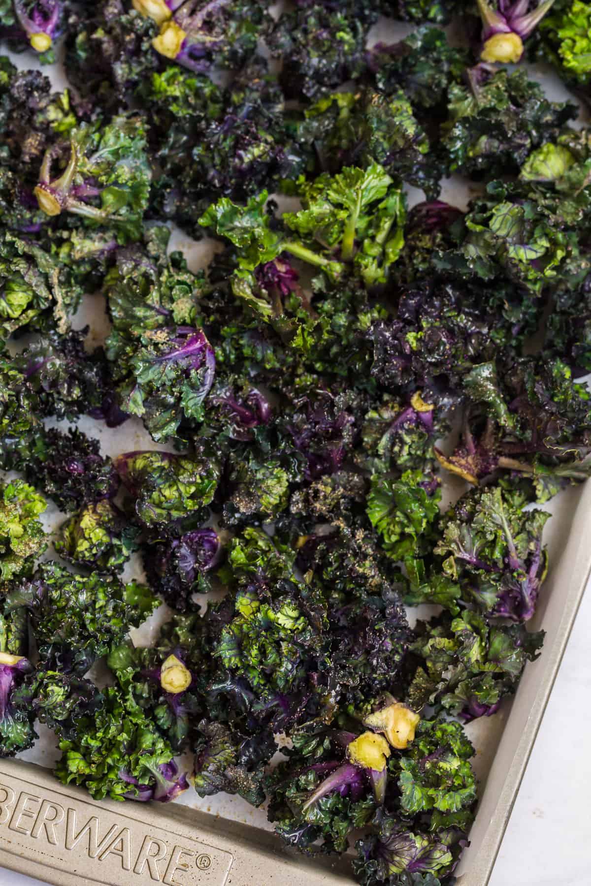 raw kalettes drizzled with olive oil, salt, pepper, and garlic powder